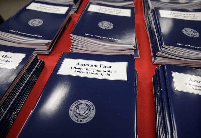 Copies of President Donald Trump's first budget are displayed at the Government Printing Office in Washington, Thursday, March, 16, 2017.THE ASSOCIATED PRESS