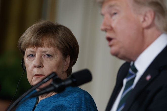 German Chancellor Angela Merkel listens as President Donald Trump speaks during their joint news conference in the East Room of the White House in Washington, Friday, March 17, 2017. (AP Photo/Evan Vucci)