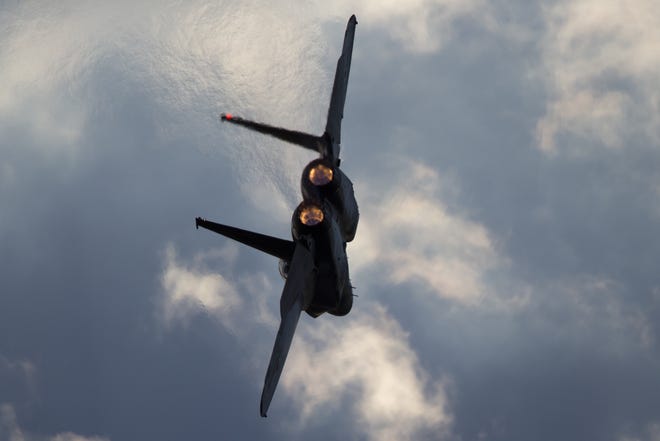 This Thursday, Dec. 29, 2016 photo shows an Israeli Air Force F-15 plane in flight during a graduation ceremony for new pilots in the Hatzerim air force base near the city of Beersheba, Israel. Anti-aircraft missiles were launched from Syria into Israeli-controlled territory early on Friday, following a series of Israeli airstrikes inside Syria, the Israeli military said. The military said its warplanes struck several targets in Syria and were back in Israeli-controlled airspace when several anti-aircraft missiles were launched from Syria toward the Israeli jets. (AP Photo/Ariel Schalit)