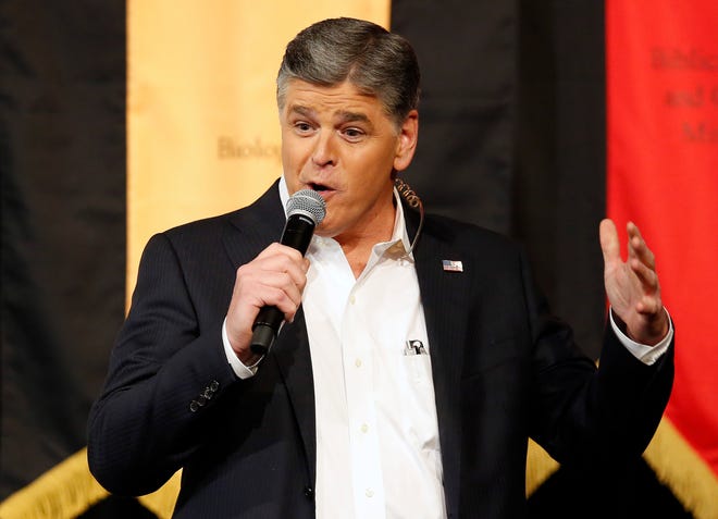 FILE - In this March 18, 2016, file photo, Fox News Channel's Sean Hannity speaks during a campaign rally for Republican presidential candidate, Sen. Ted Cruz, R-Texas, in Phoenix. Hannity denied a CNN report on March 16, 2017, that he pointed a gun at Fox News colleague Juan Williams on the network's set following an on-air argument between the pair. (AP Photo/Rick Scuteri, File)