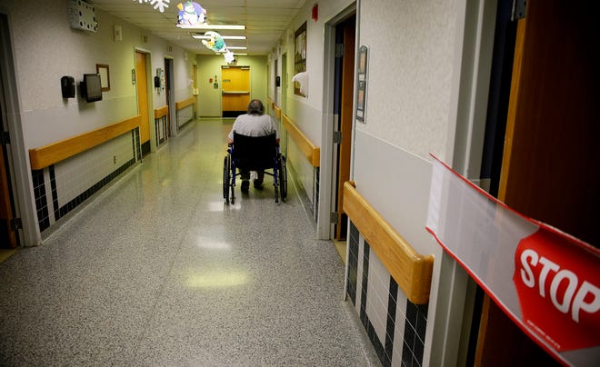 A resident sits in the hallway in the special needs unit at the Oklahoma Department of Veterans Affairs' Talihina Veterans Center in this photo from 2017. [Photo by Mike Simons, Tulsa World file]