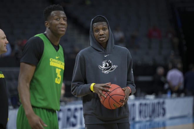 Oregon's Kavell Bigby-Williams and Chris Boucher talk during practice before the Ducks' first round matchup in the NCAA Division 1 Men's Basketball Championship at the Golden 1 Center in Sacramento, Calif. Bigby-Williams is expected to see increased playing time with the injury of Chris Boucher. (Andy Nelson/The Register-Guard)