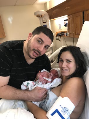 Mauricio and Kaitlin Escobar with their newborn son Elias. COURTESY PHOTO