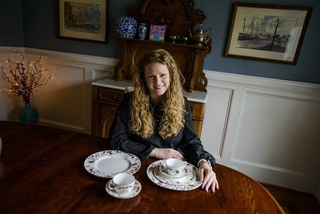 Maggie Baker with her set of fine china that was passed down from her grandmother, who received it from her great grandmother. [Staff photo by Shane Dunlap]
