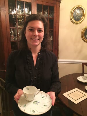 Coco Smith is pictured with china she inherited from her grandmother. The china originally belonged to her great-grandmother. [Contributed photo]