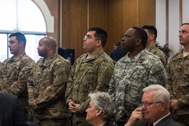 Fort Bragg soldiers on Friday graduated from the Changing Lanes training program at Fayetteville Technical Community College. The nine soldiers are the first to graduate from the program, which is a collaborative effort between Fort Bragg, FTCC and Caliber Collision. [Photo by Geneve Mankel]