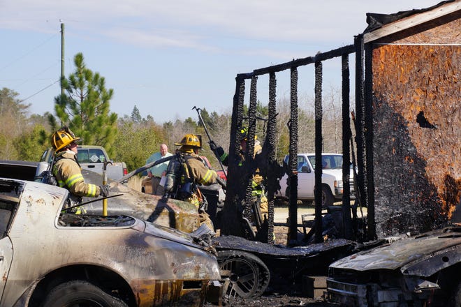 Three mobiles homes and four cars were damaged by a fire in Moore County on Friday afternoon. [Contributed photo]