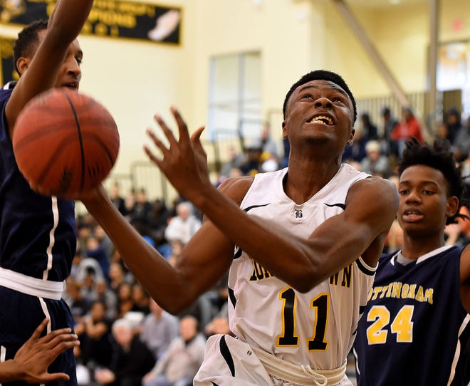 (File) Bordentown's Manny Ansong goes in for a basket during a game against Nottingham in December.