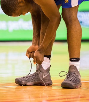 RYAN MICHALESKO/JOURNAL STAR Whitney Young and Simeon High Schools sport the Nike Kevin Durant 9 Elite basketball shoes. The two schools serve as Nike-brand schools and were chosen to wear the shoes for the State tournament.