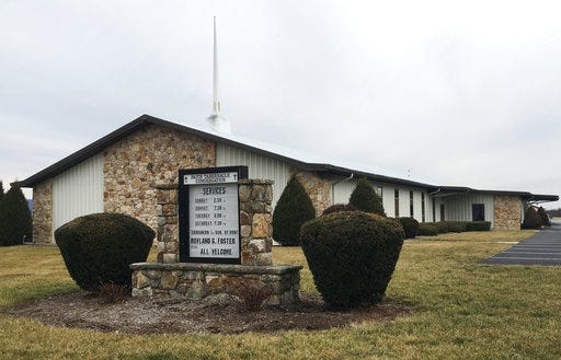 This Feb. 3, 2017, photo shows the Faith Tabernacle Congregation in Mechanicsburg, Pa. The church's pastor, the Rev. Rowland Foster, has been charged in connection with the pneumonia death of his granddaughter. (AP Photo/Michael Rubinkam)