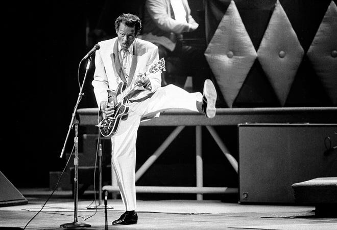 In this Oct. 17, 1986 file photo, Chuck Berry performs during a concert celebration for his 60th birthday at the Fox Theatre in St. Louis, Mo. On Saturday, police in Missouri said Berry has died at the age of 90. [James A. Finley/Associated Press File Photo]