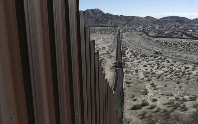 A truck drives near the Mexico-U.S. border fence separating Anapra, Mexico and Sunland Park, New Mexico. Columnist Sam Asano says the Trump administration, instead of building a wall between the U.S. and Mexico, should suspend NAFTA, establish tariffs for imported goods, and establish fees for fund transfers from immigrants in America to where they are from. [AP Photo/Christian Torres, file]