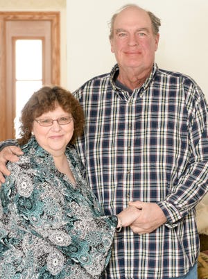 Nancy and Richard Bartlett of Magnolia pose for a picture. Richard is being treated for an aggressive from of cancer that was discovered by his dentist. (CantonRep.com / Michael Balash)