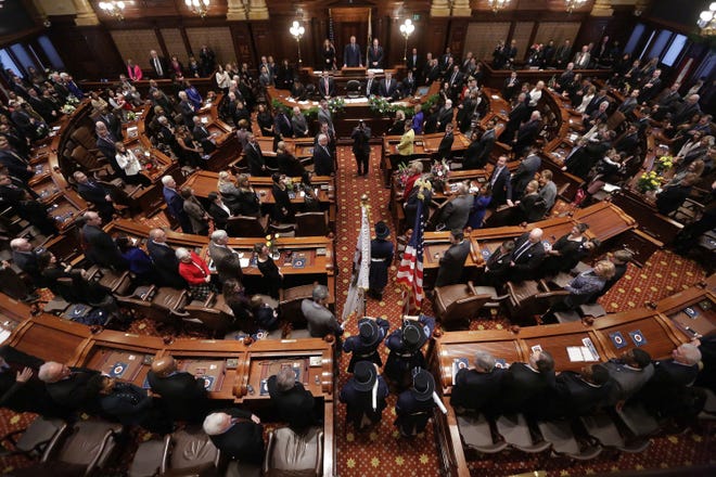 FILE - In this Jan. 14, 2015, file photo, politicians gather in the Senate chambers at the Illinois State Capitol in Springfield Ill. The Illinois Senate's "grand bargain" budget compromise has had a rough go. And that doesn't count taxpayer response. Voters have objected to the sprawling proposal in state Capitol rallies, letters and witness testimony. (AP Photo/Seth Perlman File)