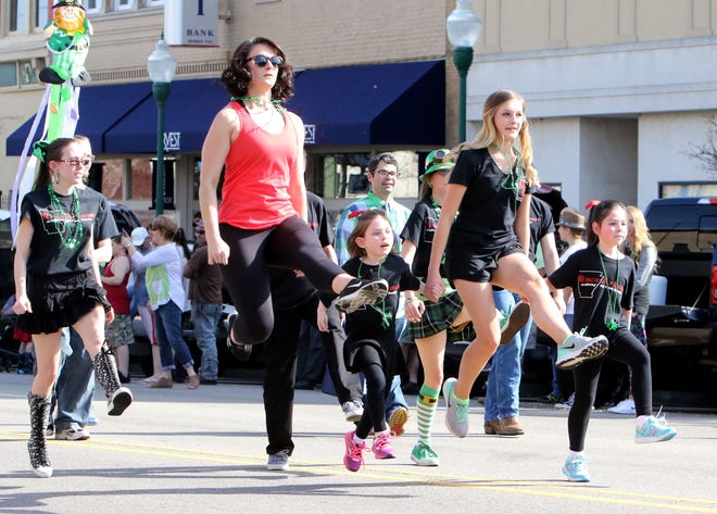 Members of the Rince Arkansas Academy of Irish Dance make their way along Garrison Avenue on Saturday, March 18, 2017, during the annual St. Patrick's Day Parade. [JAMIE MITCHELL/TIMES RECORD]