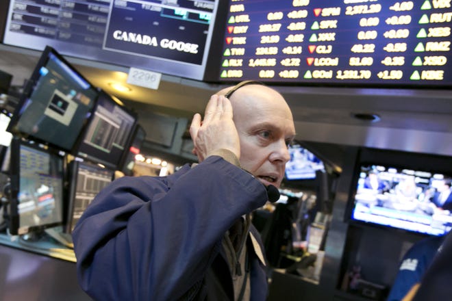 Trader Daniel Leporin works on the floor of the New York Stock Exchange, Monday, March 20, 2017. THE ASSOCIATED PRESS