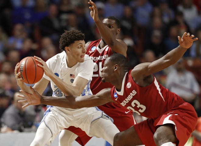 The NCAA Tournament started with nine ACC teams, but only Justin Jackson, left, and North Carolina remain. [AP Photo/Chuck Burton]