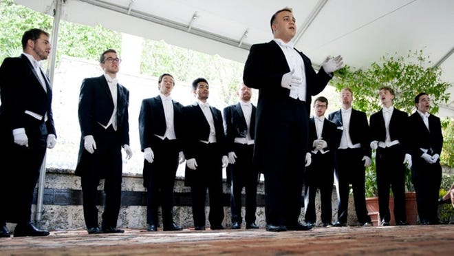 Zak Kayal, front right, performs with the his fellow Yale Whiffenpoofs Friday in Pan’s Garden in Palm Beach. (Meghan McCarthy / Daily News)