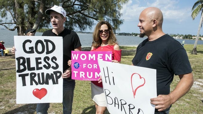 Brett Borders, Valeria Bianco and Ronald Zuniga were chosen to go to Mar-a-Lago and meet Donald Trump on Saturday. They returned to Bingham Island on Sunday to cheer him on as he left town. (Melanie Bell / Daily News)