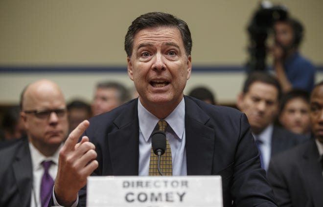 In this July 7, 2016, file photo, FBI Director James Comey testifies before the House Oversight Committee about Hillary Clinton's email investigation, at the Capitol in Washington. The House intelligence committee is to begin hearings Monday, March 20, 2017 into Russia's role in cybersecurity breaches at the Democratic National Committee, as well as President Donald Trump's unsubstantiated claim that his predecessor had authorized a wiretap of Trump Tower. Comey and Mike Rogers, the director of the National Security Agency, are slated to testify. THE ASSOCIATED PRESS