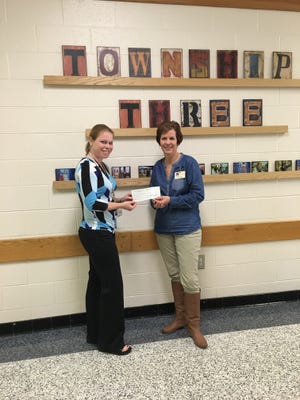 [Special to The Star] Brandy Curtis, assistant principal at Township No. 3, presents a check for $1,500 from Elizabeth Baptist Church to Catherine Hastings, school social worker.