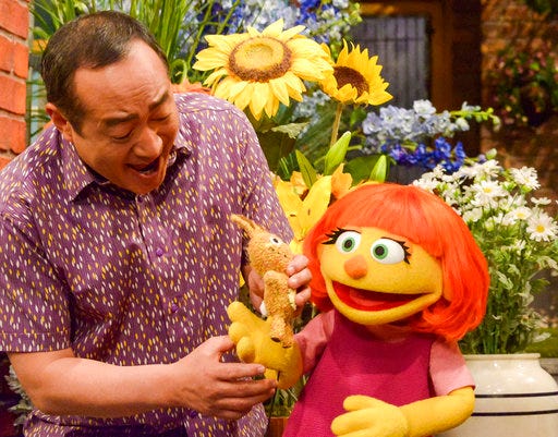 This image released by Sesame Workshop shows Julia, a new autistic muppet character debuting on the 47th Season of "Sesame Street," on April 10, on both PBS and HBO.