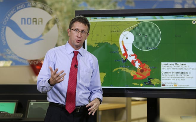 FILE- In this Oct. 5, 2016 file photo. National Hurricane Center director Rick Knabb speaks during a televised forecast regarding the threat of Hurricane Matthew in Miami. Knabb resigned as the center director and is returning to The Weather Channel as an on-air hurricane expert. Knabb has been the director of the National Hurricane Center in Miami since 2012. (AP Photo/Wilfredo Lee, File)