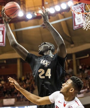Central Florida's Tacko Fall (24) rebounds the ball over Illinois State's DJ Clayton (2) during an NCAA college basketball game in the NIT on Monday, March 20, 2017, in Normal, Ill. (Ryan Michalesko/Journal Star via AP)