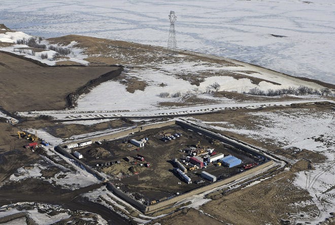 In this Feb. 13, 2017, aerial file photo shows the site where the final phase of the Dakota Access pipeline will take place with boring equipment routing the pipeline underground and across Lake Oahe to connect with the existing pipeline in Emmons County near Cannon Ball, N.D. Environmental activists who tried to disrupt some oil pipeline operations in four states to protest the pipeline say they aren't responsible for any recent attacks on that pipeline. Dakota Access developer Energy Transfer Partners said in court documents Monday, March 20, 2017, that there have been "coordinated physical attacks" along the $3.8 billion pipeline that will carry oil from North Dakota to Illinois. THE ASSOCIATED PRESS