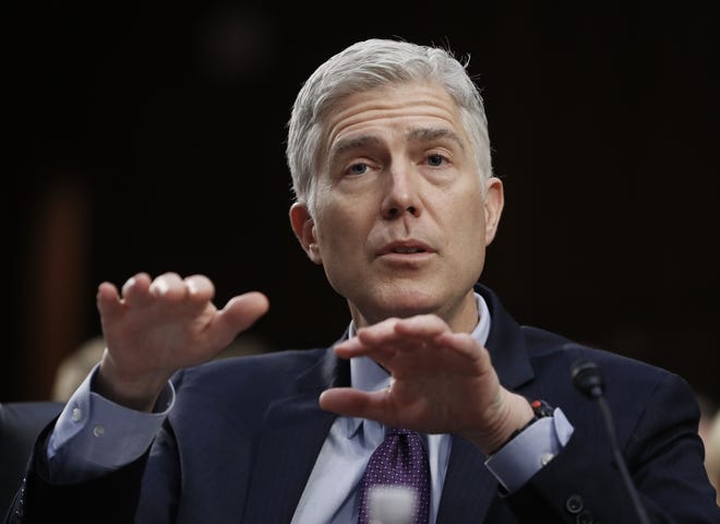 Supreme Court Justice nominee Neil Gorsuch gestures as he testifies on Capitol Hill in Washington, Tuesday, March 21, 2017, at his confirmation hearing before the Senate Judiciary Committee. THE ASSOCIATED PRESS