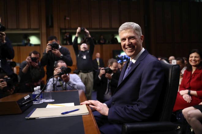 Supreme Court nominee Neil Gorsuch smiles before the start of a Senate Judiciary Committee confirmation hearing in Washington on March 20, 2017. ANDREW HARRER/BLOOMBERG