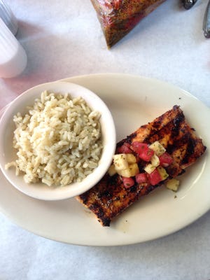 The grilled salmon with lime rice dish at Anchors Away, a new seafood restaurant in Peoria. JOURNAL STAR/THOMAS BRUCH