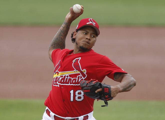 St. Louis Cardinals starting pitcher Carlos Martinez (18) throws in the first inning of a spring training baseball game against the New York Mets Wednesday, March 1, 2017, in Jupiter, Fla. (AP Photo/John Bazemore)