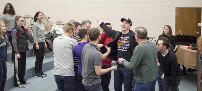 Alex Mulcahey, center, practices with the cast of “Joseph and the Amazing Technicolor Dreamcoat” for this weekend’s production at LCU. [Photo by Lincoln Christian University]