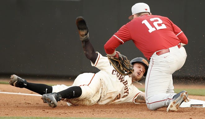 Oklahoma's Brylie Ware tags out Oklahoma State's Andrew Rosa in an earlier Bedlam matchup this season. Photo by Bryan Terry, The Oklahoman