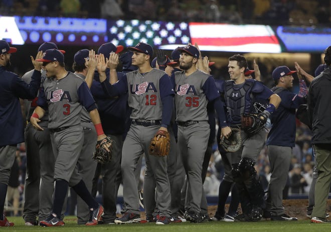 United States celebrates after defeating Japan, 2-1, in a semifinal in the World Baseball Classic in Los Angeles, Tuesday. The Associated Press