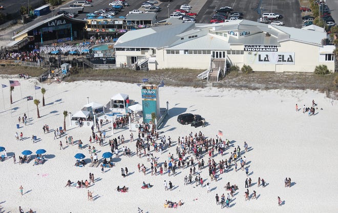 Spring Breakers gather on the beach outside of Club LaVela on March 18 in Panama City Beach. [PATTI BLAKE/THE NEWS HERALD]