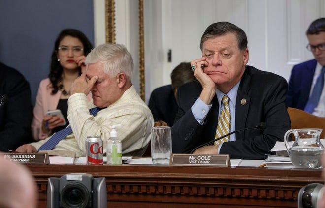 After eight hours of debate, House Rules Committee Chairman Rep. Pete Sessions, R-Texas, left, and Rep. Tom Cole, R-Okla., the vice-chair, listen to arguments from committee chairs as the panel meets to shape the final version of the Republican health care bill before it goes to the floor for debate and a vote, Wednesday, on Capitol Hill in Washington. (AP Photo/J. Scott Applewhite)