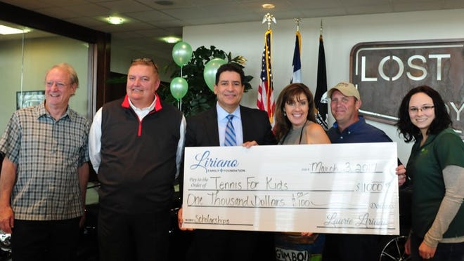 Bastrop community leaders recently gathered at Lost Pines Toyota for a check presentation from the Liriano Family Foundation to help fund a new city youth tennis league, Tennis For Kids. From left are Mayor Ken Kesselus, BISD Athletic Director Bob Jones, Carlos and Laurie Liriano, City Parks & Recreation Director Trey Job, and City Recreation Coordinator Victoria Herbrich. Terry Hagerty Photography