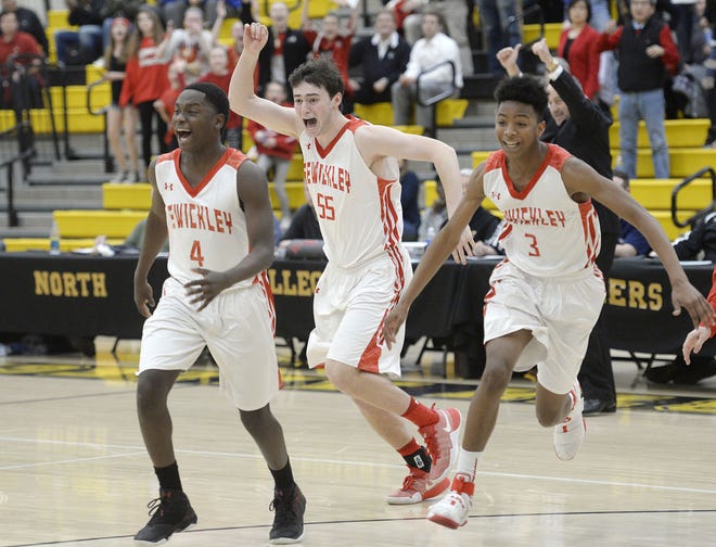 Sewickley Academy's Isaiah Smith (4), Teddy McClain (55) and Isiah Warfield (3) run on to the court after defeating Bishop Canevin 50-48 in a PIAA Class 2A semifinal game Tuesday at North Allegheny High School.