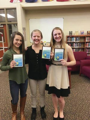 Three Boone Middle School students had the top speeches in a recentl Modern Woodmen speech contest on the topic “What does it mean to be a hero?” They’ll represent Boone at districts on March 25. From the left are Boone eighth-graders Samantha Disbrowe, Karly Sorensen, and Savannah Heldenbrand. (Courtesy photo).