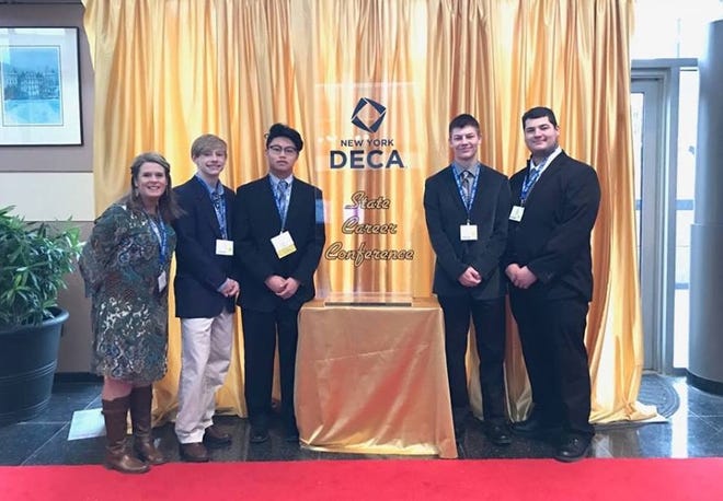 Hornell DECA members, Kyle Colucci, Tyler Green, Payce Hooker and Alex Nelson. Along with advisor Pamela Mendel they represented Hornell High School at a statewide Career Conference in Rochester. [PHOTO PROVIDED]