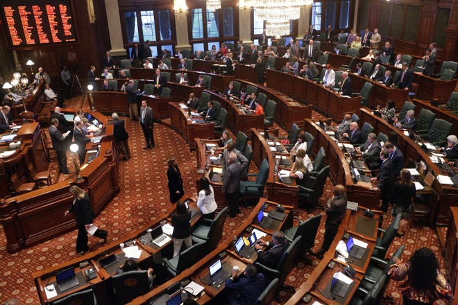 Illinois lawmakers debate legislation while on the House floor during session at the Illinois State Capitol on Thursday, June 30, 2016, in Springfield. AP