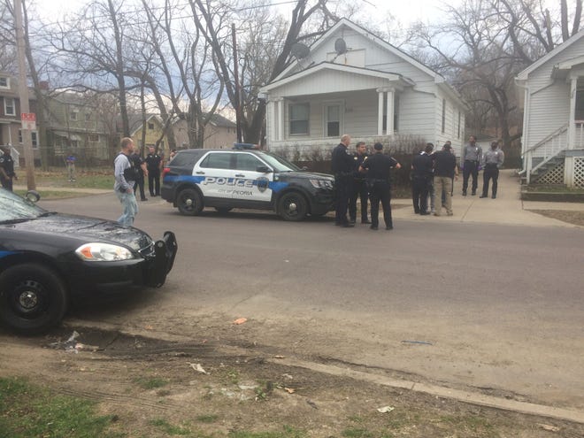 ANDY KRAVETZ/Journal Star

Peoria police officers have one person in handcuffs in the 300 block of East Nebraska Avenue after he was allegedly seen carrying a handgun on Friday.