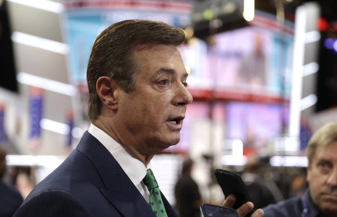 In this July 17, 2016, file photo, then-Trump campaign chairman Paul Manafort talks to reporters on the floor of the Republican National Convention in Cleveland. THE ASSOCIATED PRESS