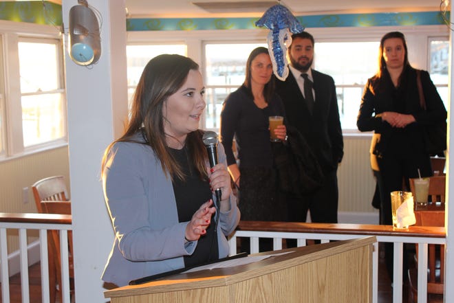 Young attorney Brittany Raposa tells a fund-raiser Thursday how much she was helped by the Judge William H. Carey Student Opportunity Fund. [Steve Urbon/Standard-Times Special/SCMG]