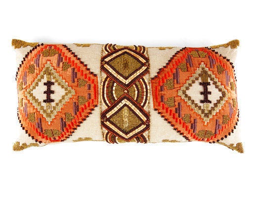 This undated photo provided by HomeGoods shows hand beading on a decorative print which makes a stunning pillow with African flair. (HomeGoods via AP)