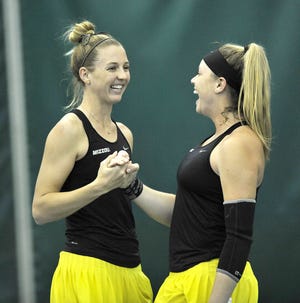 Missouri's Cassidy Spearman, left, and Tate Schroeder celebrate a point during their doubles victory in Friday's 4-2 loss to South Carolina at the Mizzou Tennis Complex.