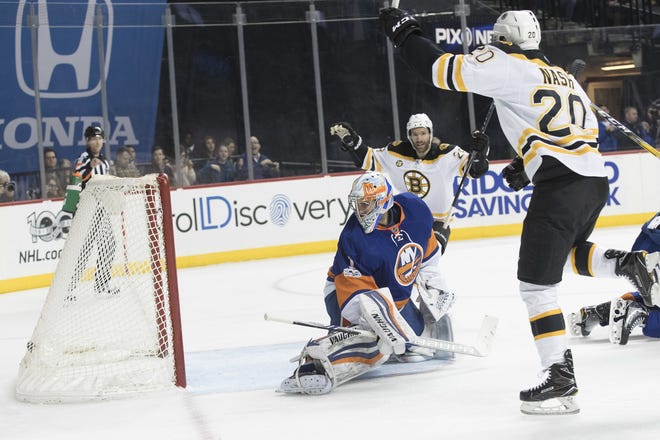 Bruins center Riley Nash celebrates after beating Islanders goalie Thomas Greiss for a first-period goal on Saturday night.