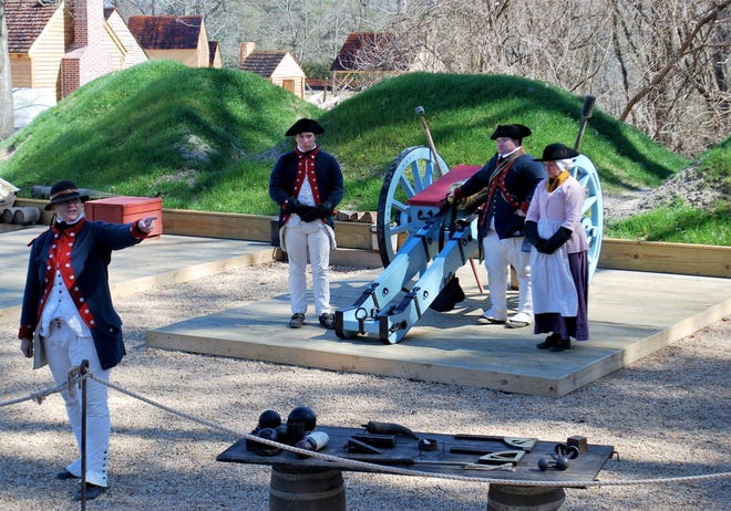 Re-enactors prepare to fire a battalion gun at the American Revolution Museum at Yorktown. [Washington Post photo by Christina Barron]